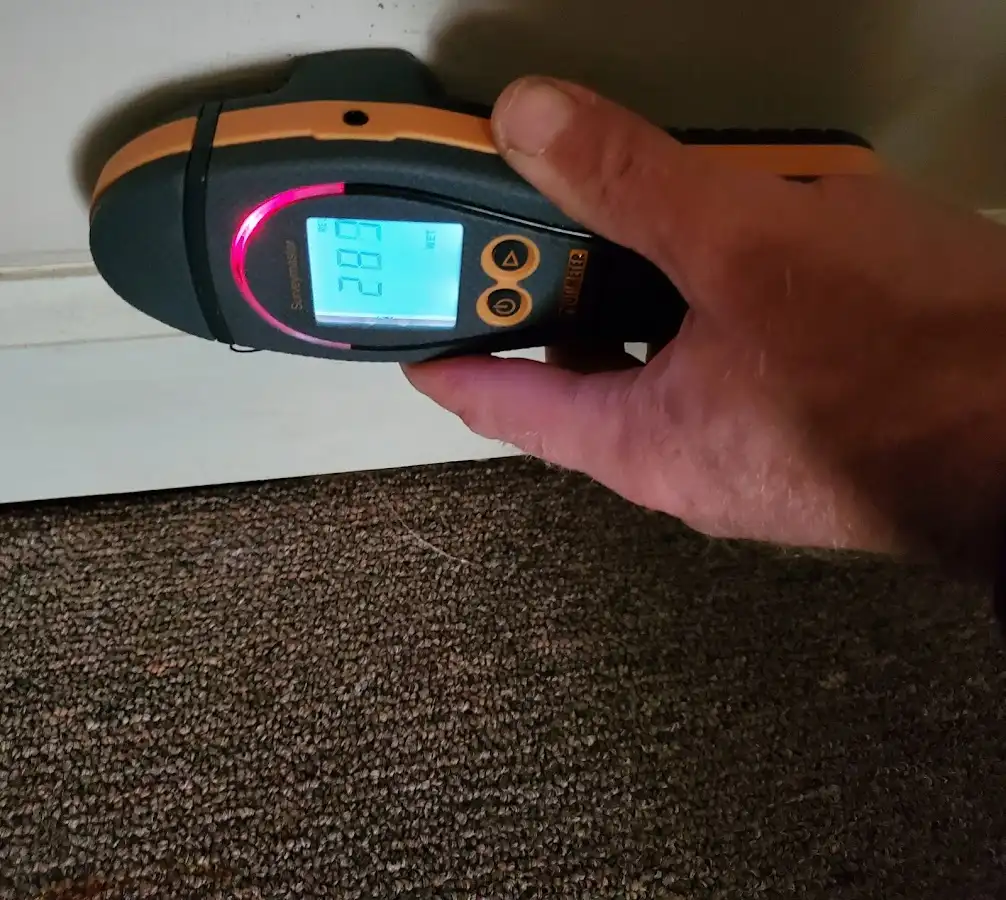 Moisture detection at baseboard during Storm Damage Restoration in Scottsbluff